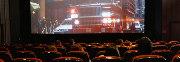 Movie theater attendees watching a film.